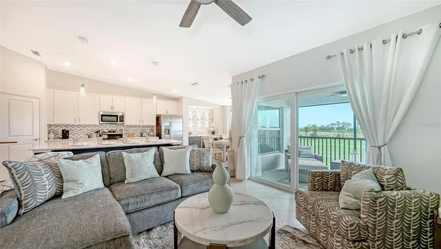 an aerial view of a house with a swimming pool patio and outdoor seating