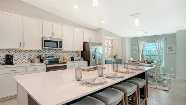 an aerial view of a house with a yard basket ball court