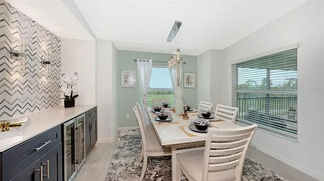 a view of a livingroom with furniture and a window