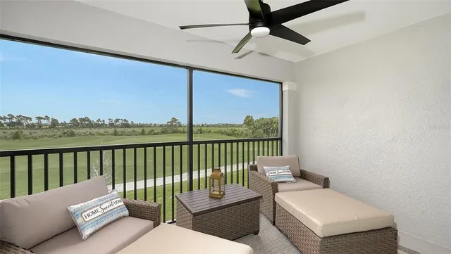 a view of a patio with a table and chairs and potted plants