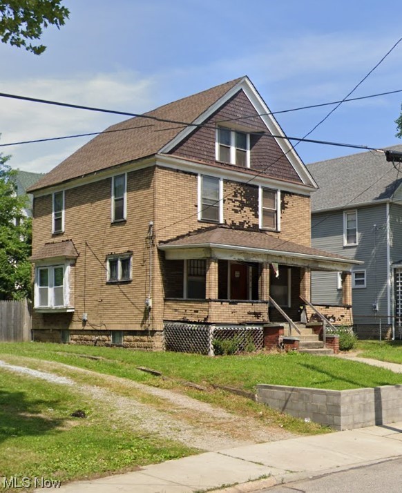 596 Rhodes Avenue Akron, OH 44307 - Photo 3 of 17 View of front of home featuring a front lawn and a porch