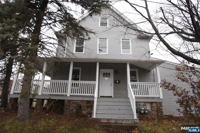 a front view of a house with a deck