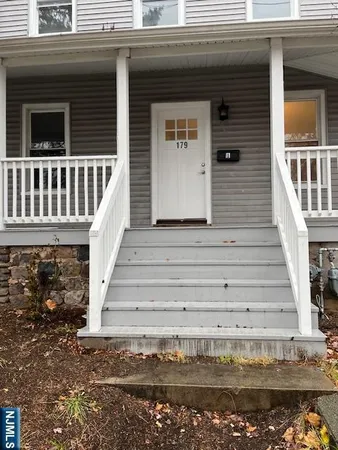 a front view of a house with stairs