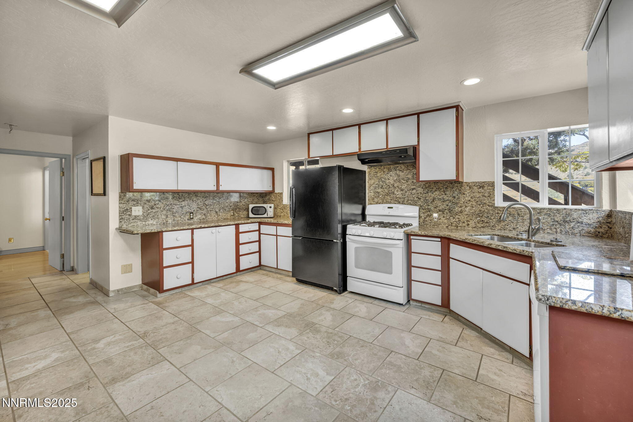 100 Pedlar Road Silver City, NV 89428 - Photo 12 of 65 a kitchen with stainless steel appliances granite countertop a stove sink and cabinets