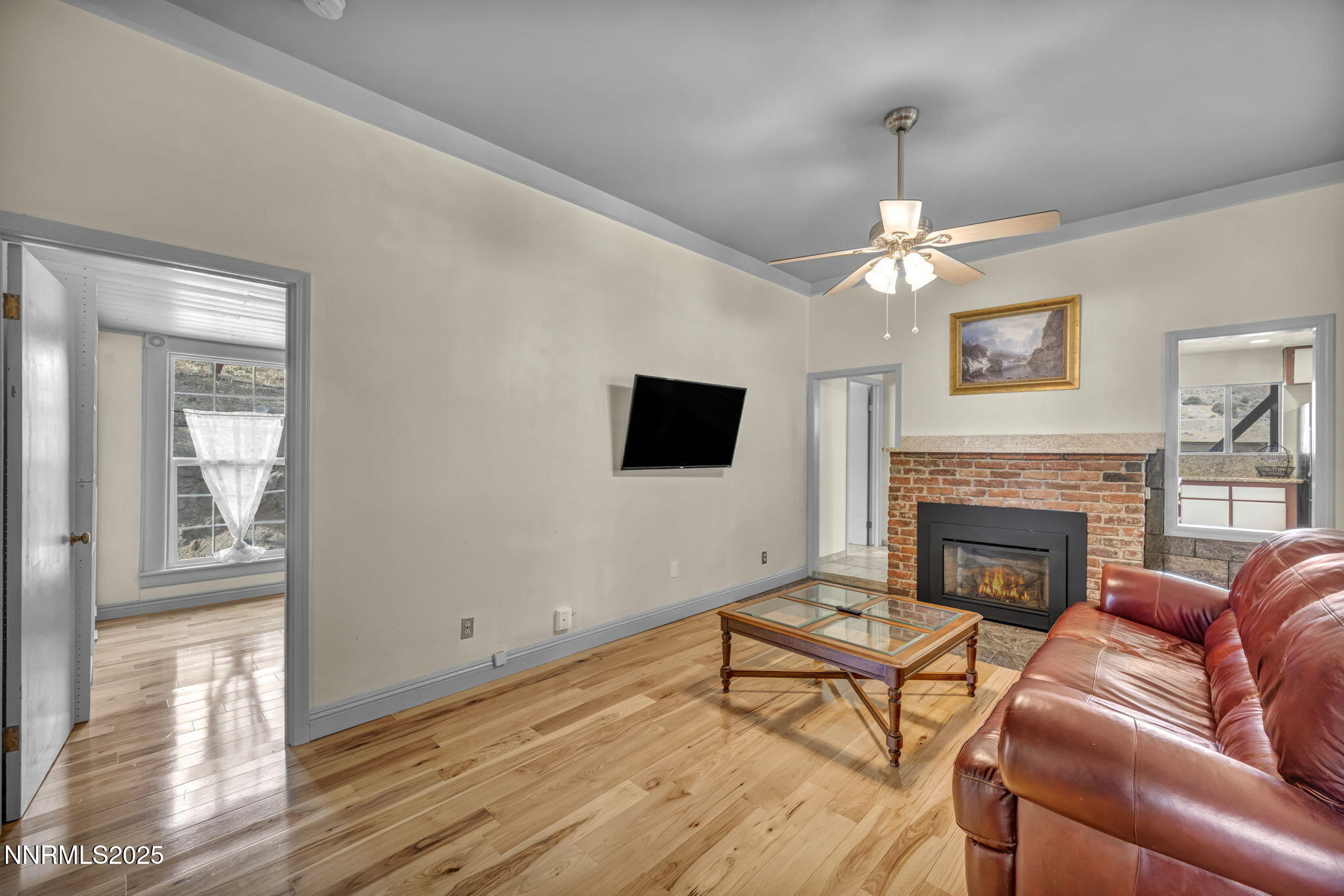 100 Pedlar Road Silver City, NV 89428 - Photo 18 of 65 a living room with furniture a fireplace and a flat screen tv