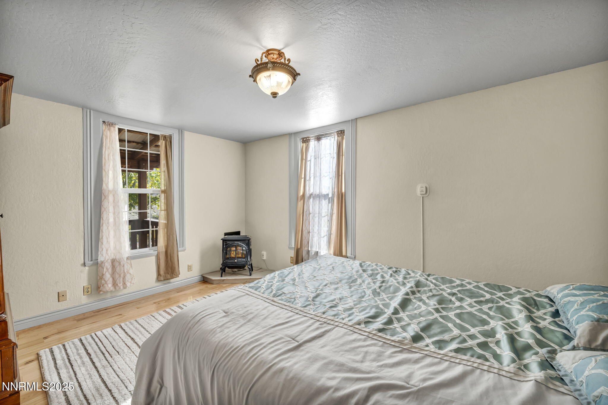 100 Pedlar Road Silver City, NV 89428 - Photo 24 of 65 a bedroom with a bed and window