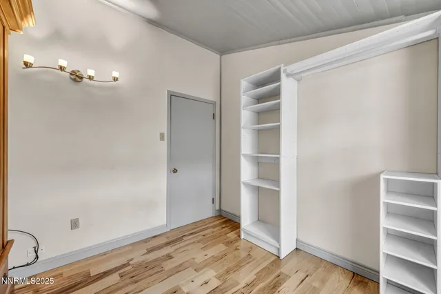 a view of balcony with wooden floor and fence