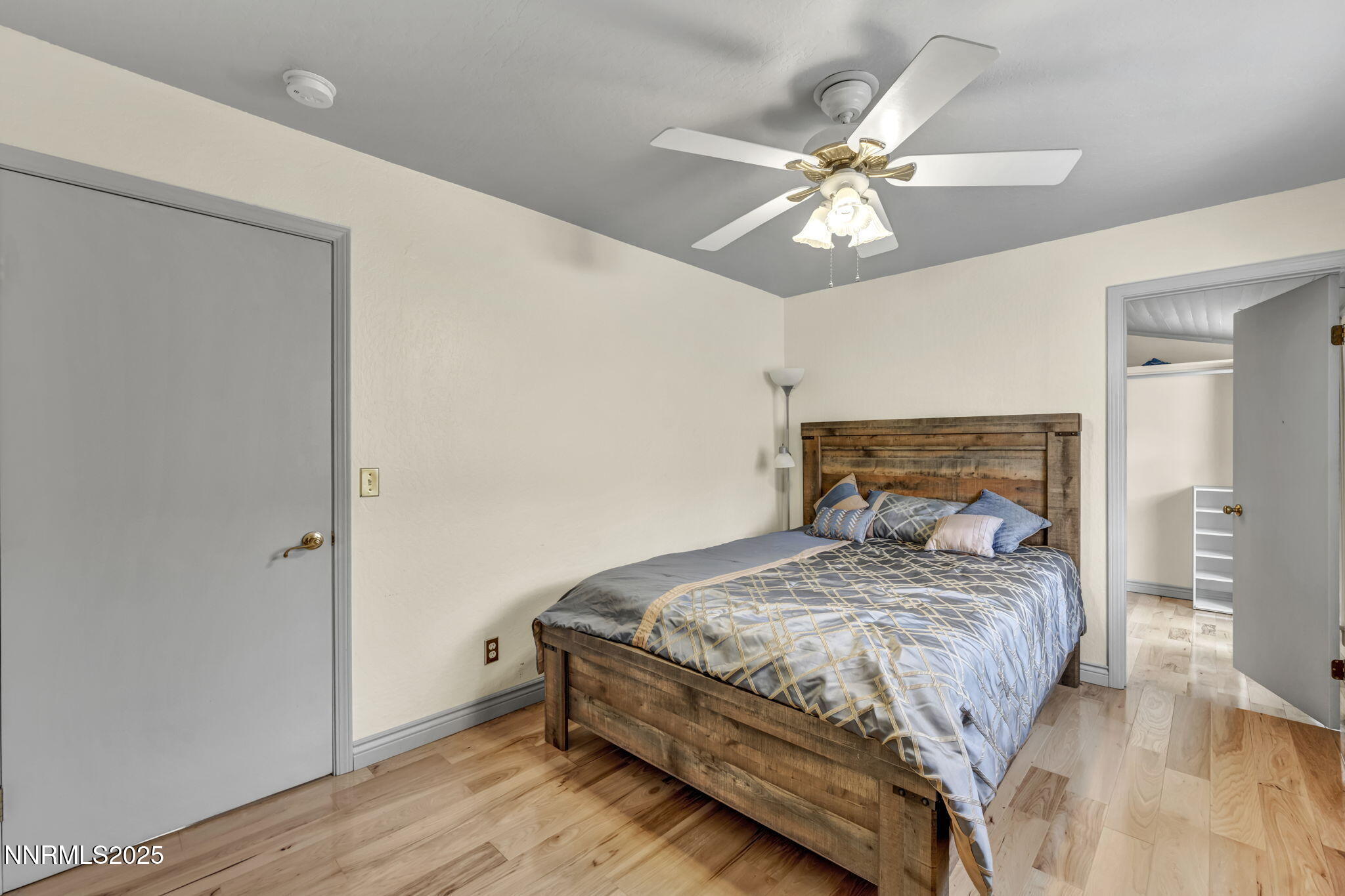 100 Pedlar Road Silver City, NV 89428 - Photo 31 of 65 a bedroom with a bed and a chandelier