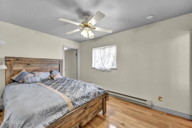 a view of an house with backyard and trees