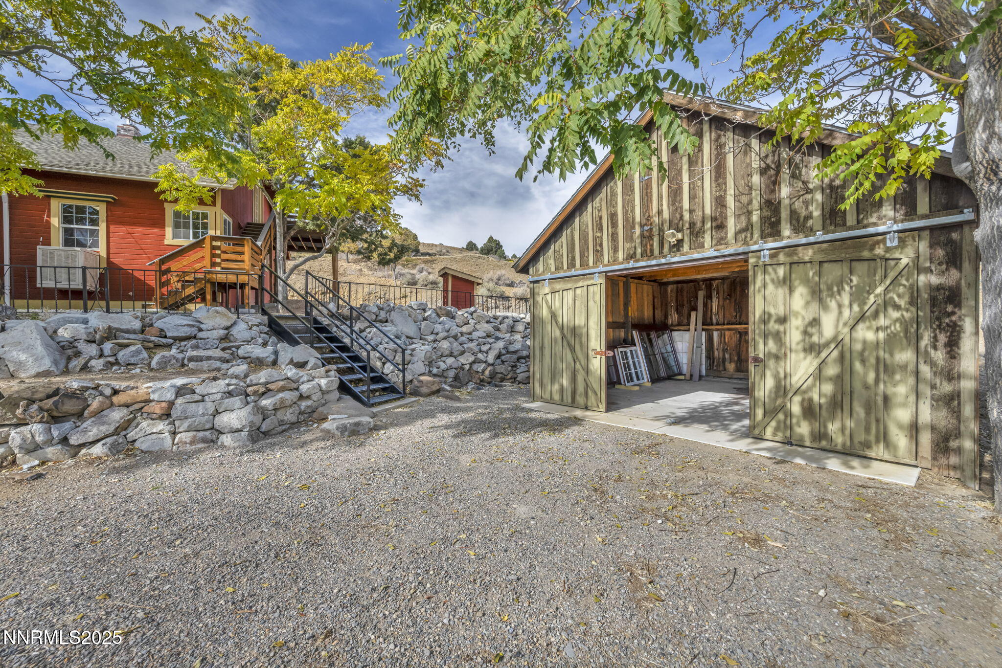 100 Pedlar Road Silver City, NV 89428 - Photo 51 of 65 a front view of a house with a tree