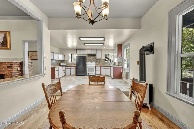 a kitchen with a refrigerator sink and cabinets