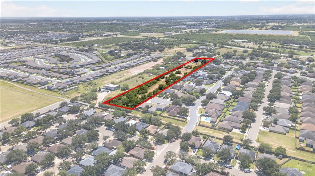 8900 North Ware Road McAllen, TX 78504 - Photo 6 of 13 Expansive rectangular parcel outlined in red, featuring significant tree coverage