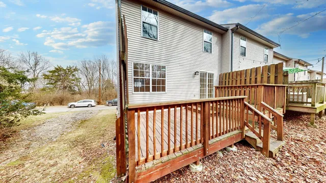 a front view of a house with a yard and balcony