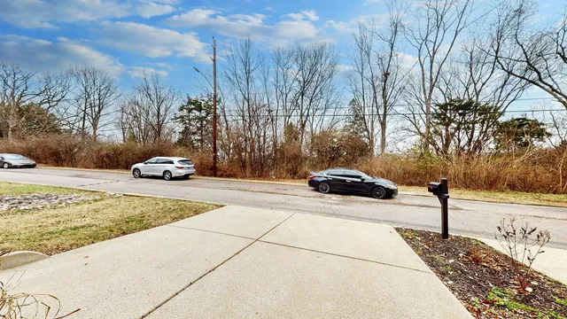 a view of balcony and a yard