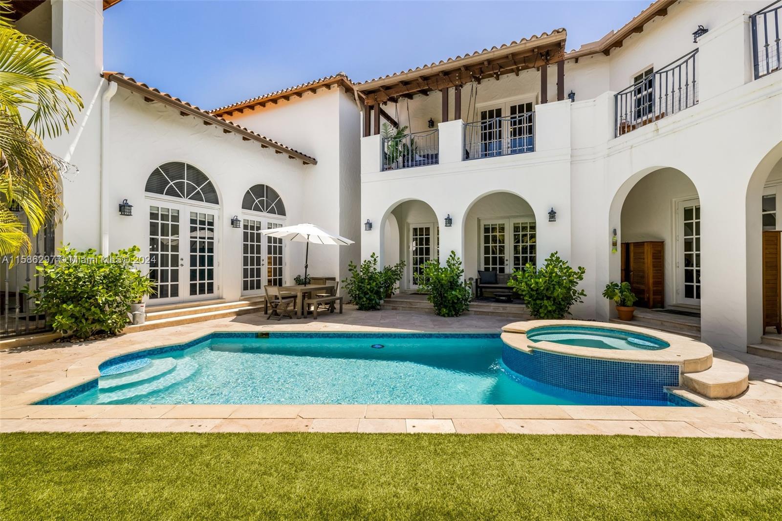 200 Ridgewood Road Coral Gables, FL 33133 - Photo 14 of 70 a front view of a house with a yard