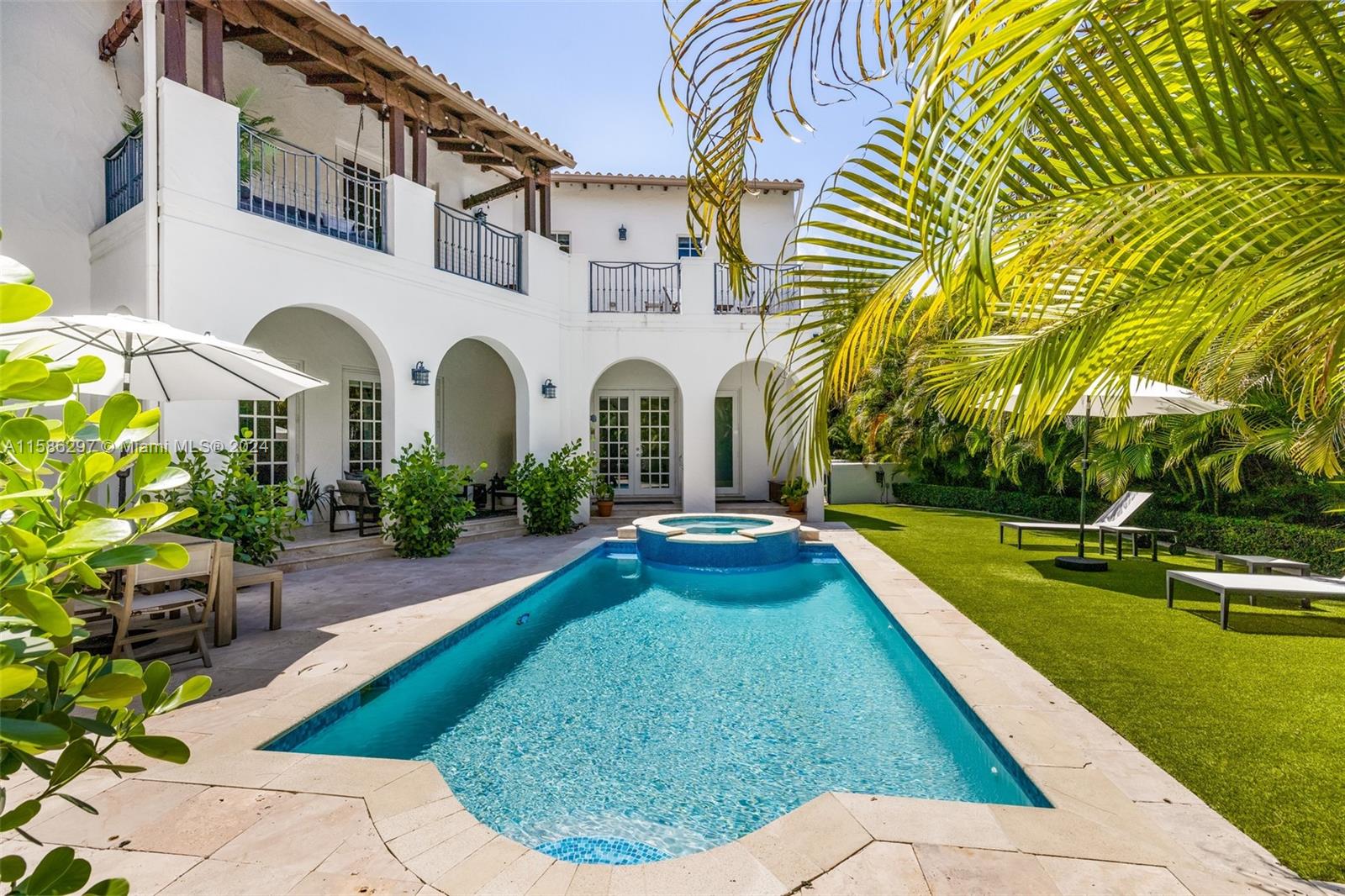 200 Ridgewood Road Coral Gables, FL 33133 - Photo 15 of 70 a view of house with swimming pool outdoor seating