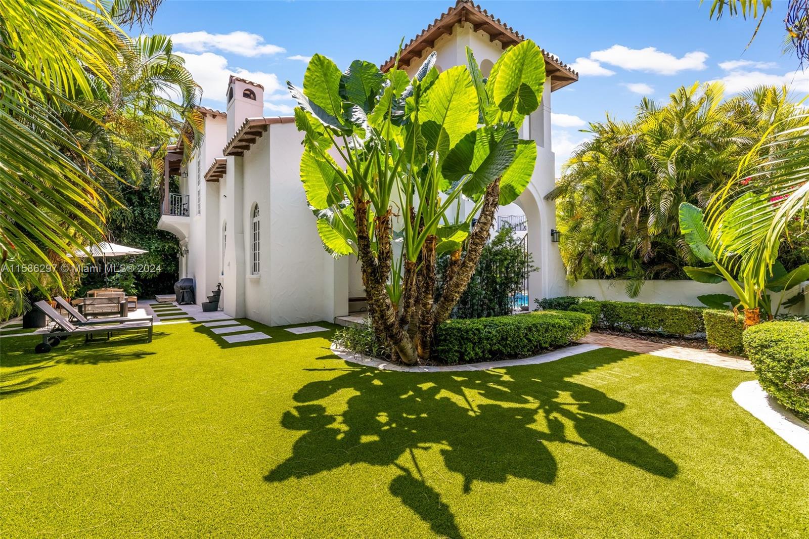 200 Ridgewood Road Coral Gables, FL 33133 - Photo 18 of 70 a view of a swimming pool with a yard