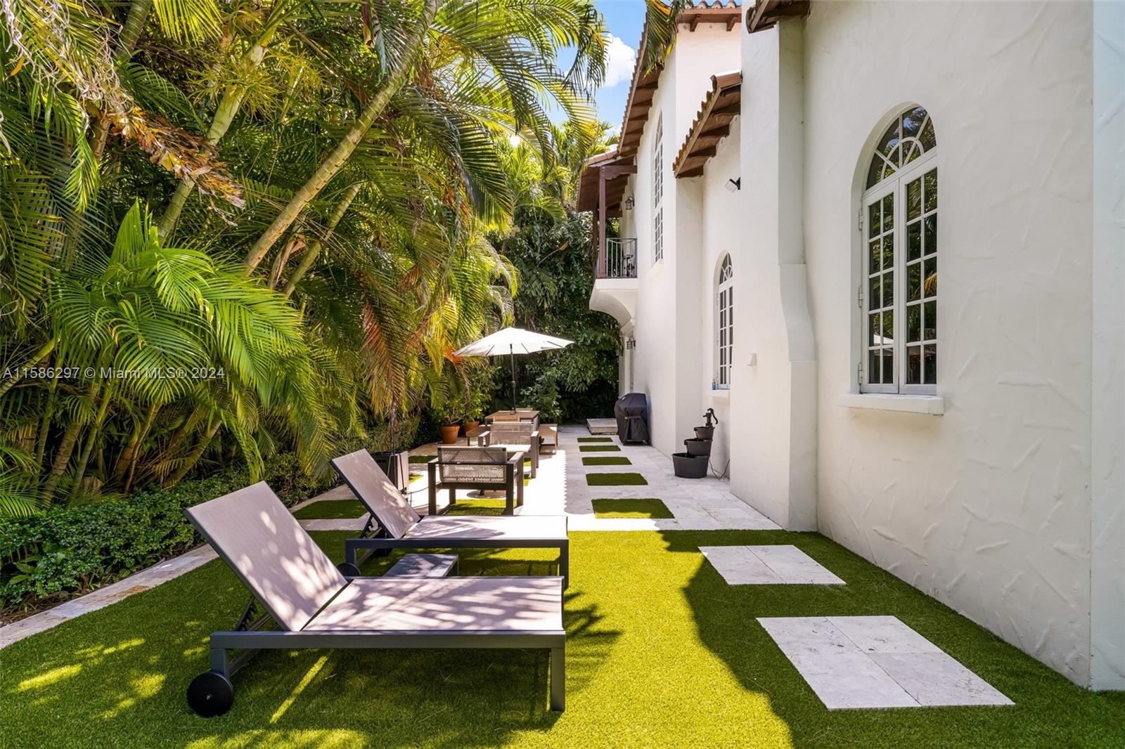 200 Ridgewood Road Coral Gables, FL 33133 - Photo 20 of 70 a view of swimming pool with outdoor seating and yard
