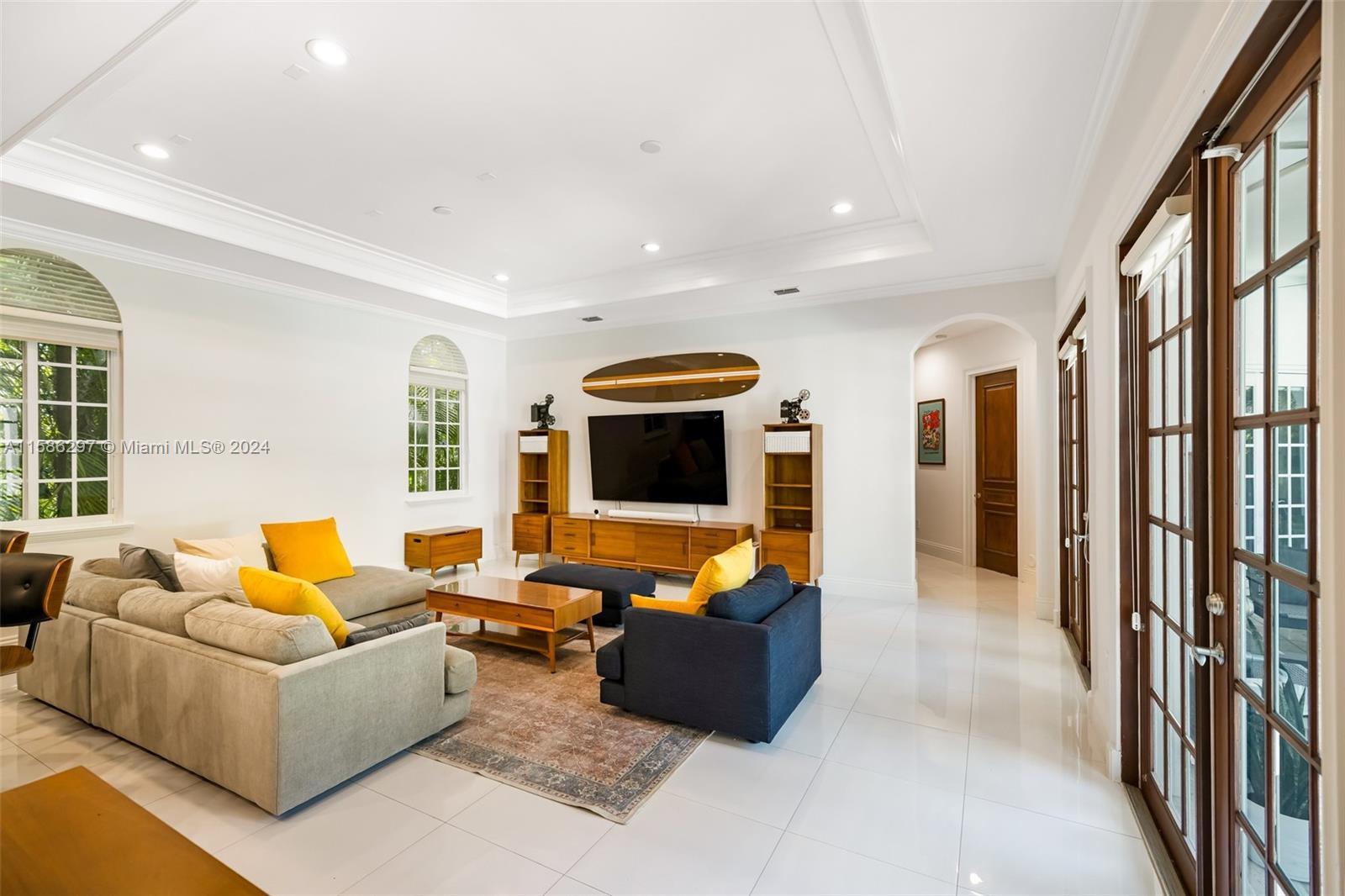 200 Ridgewood Road Coral Gables, FL 33133 - Photo 26 of 70 a living room with furniture and a flat screen tv