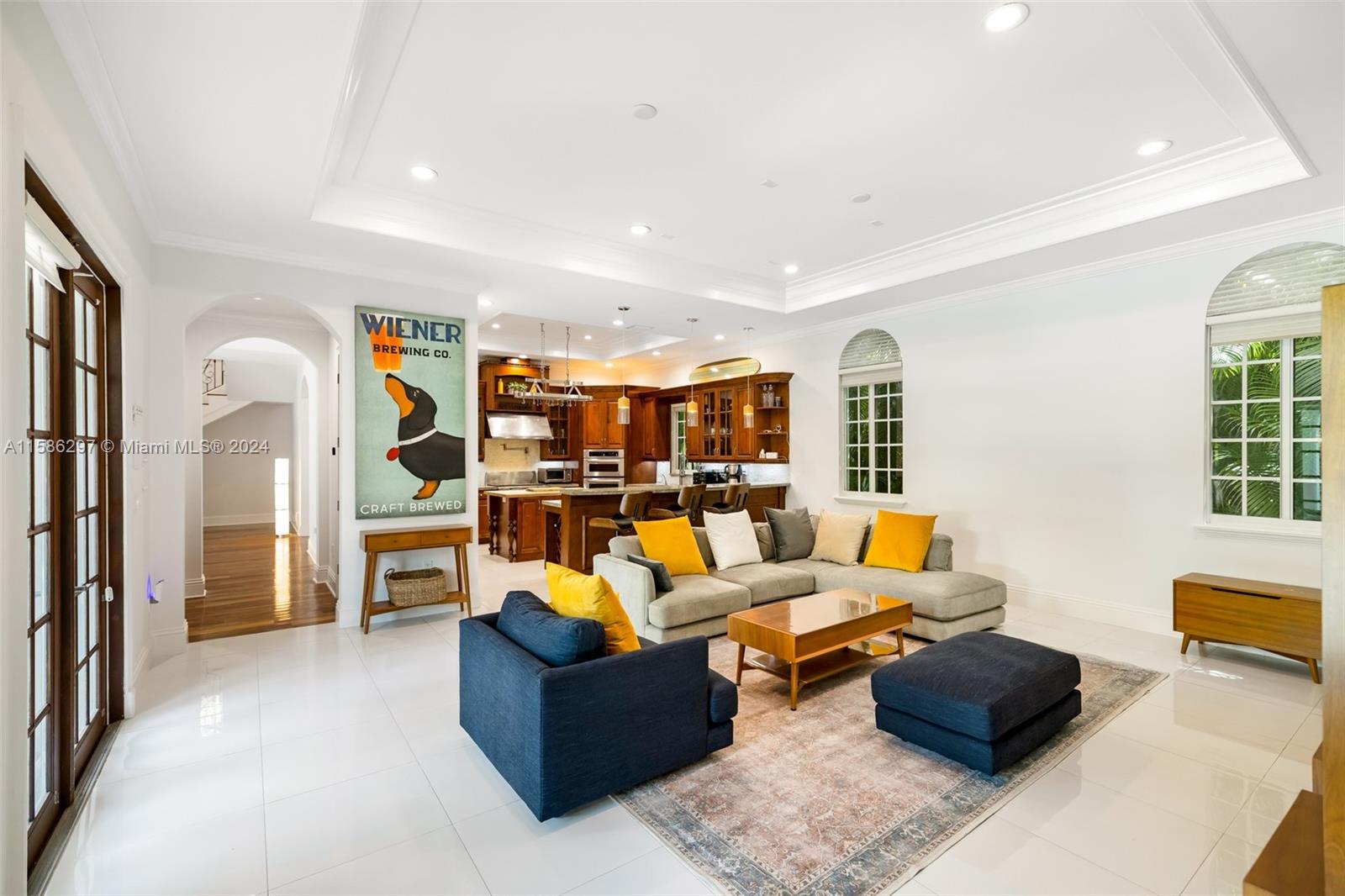 200 Ridgewood Road Coral Gables, FL 33133 - Photo 27 of 70 a living room with furniture and a lamp