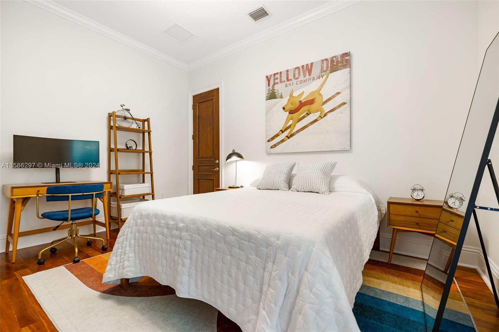 200 Ridgewood Road Coral Gables, FL 33133 - Photo 37 of 70 a bedroom with a bed and wooden floor