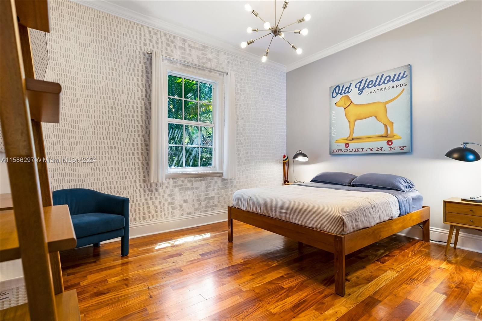 200 Ridgewood Road Coral Gables, FL 33133 - Photo 39 of 70 a bedroom with a bed and a chair