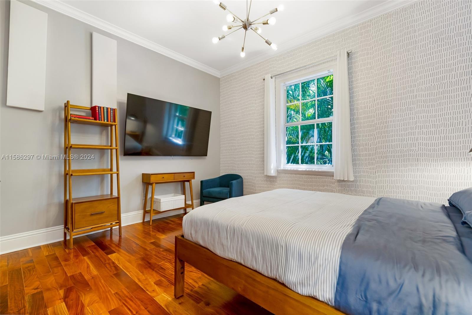 200 Ridgewood Road Coral Gables, FL 33133 - Photo 40 of 70 a bedroom with a bed and a flat screen tv