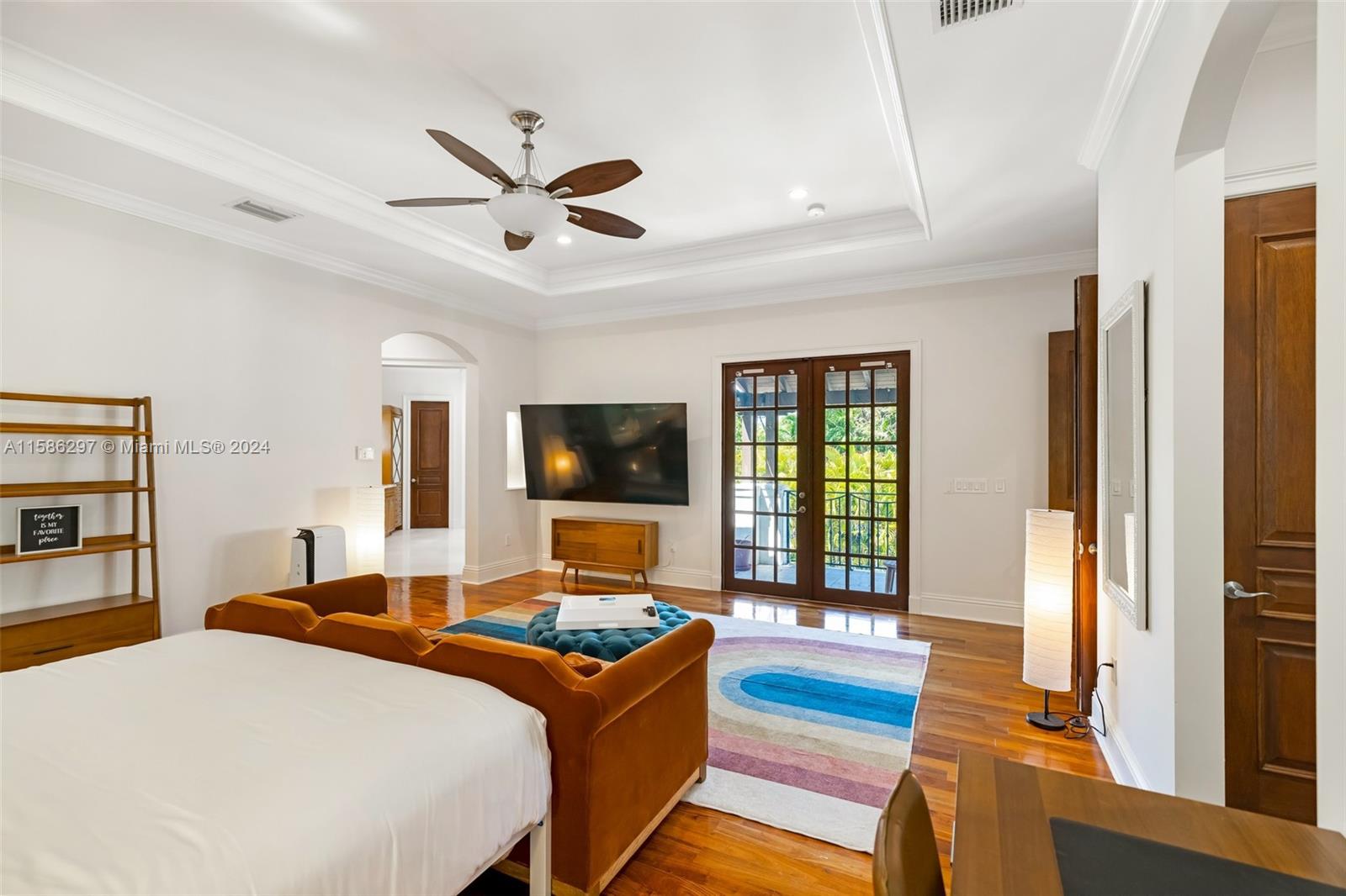 200 Ridgewood Road Coral Gables, FL 33133 - Photo 46 of 70 a bedroom with a bed and a flat screen tv