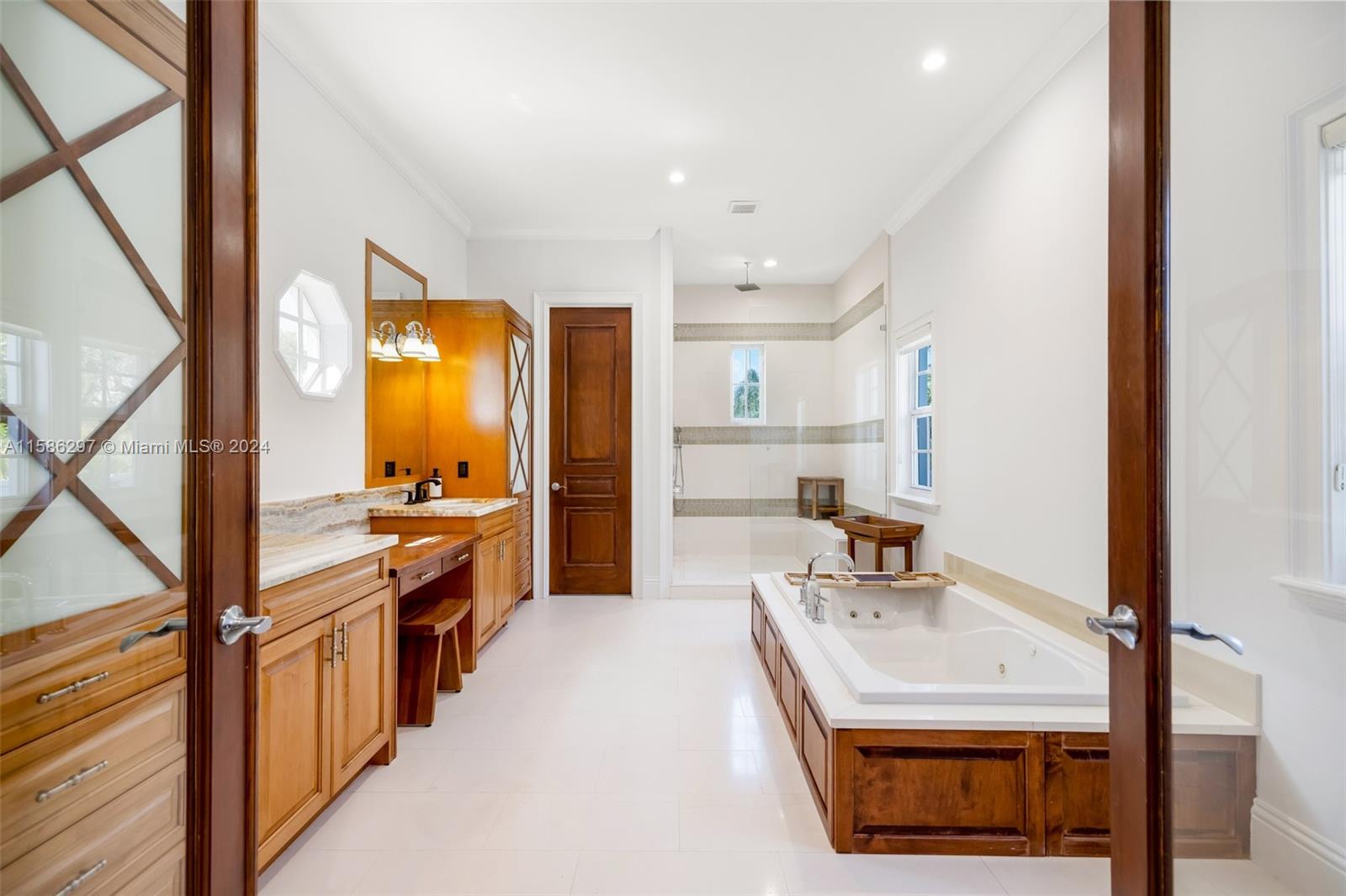 200 Ridgewood Road Coral Gables, FL 33133 - Photo 48 of 70 a kitchen with stainless steel appliances a sink stove and cabinets