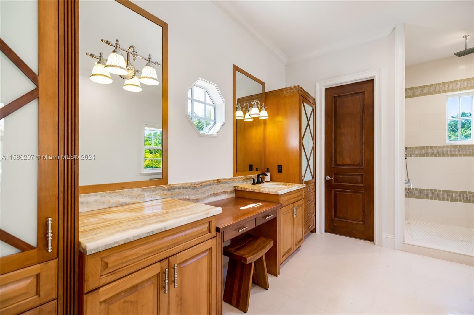 200 Ridgewood Road Coral Gables, FL 33133 - Photo 49 of 70 a bathroom with a sink a vanity and a mirror