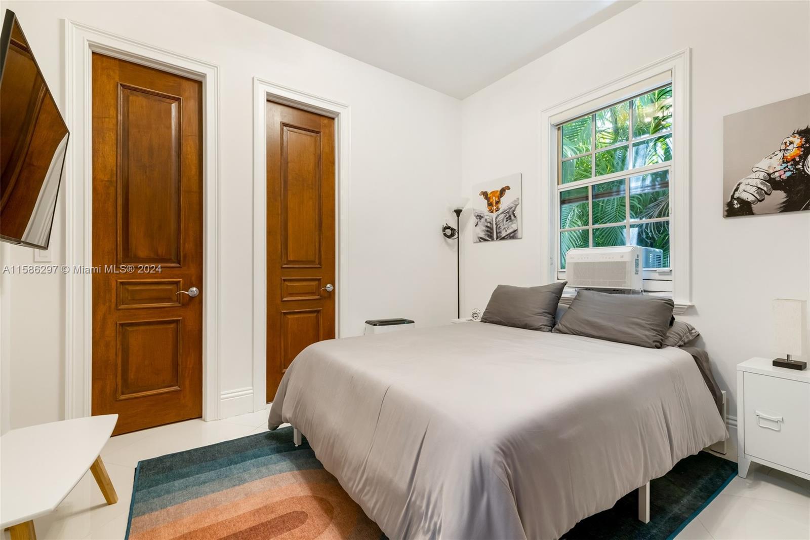 200 Ridgewood Road Coral Gables, FL 33133 - Photo 57 of 70 a bedroom with a bed and a window