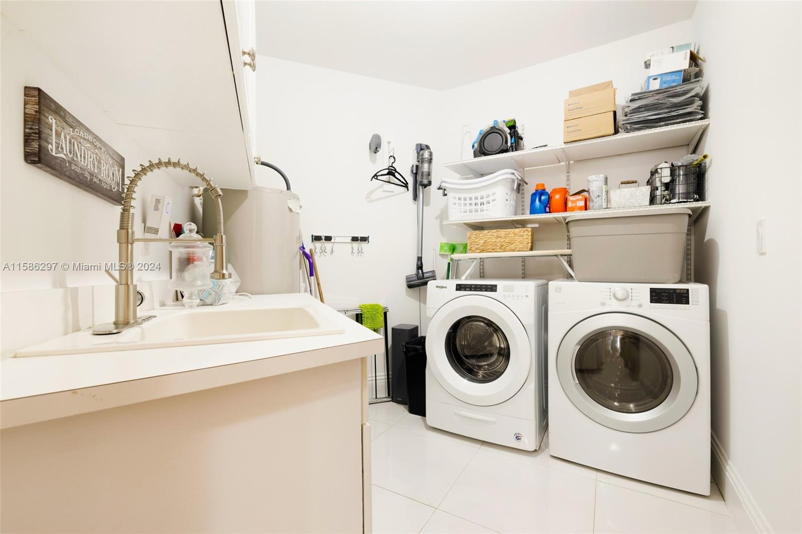 200 Ridgewood Road Coral Gables, FL 33133 - Photo 59 of 70 a utility room with dryer and washer