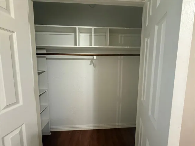 a view of an empty walk in closet