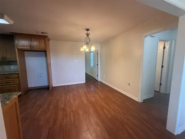 a view of a livingroom with wooden floor