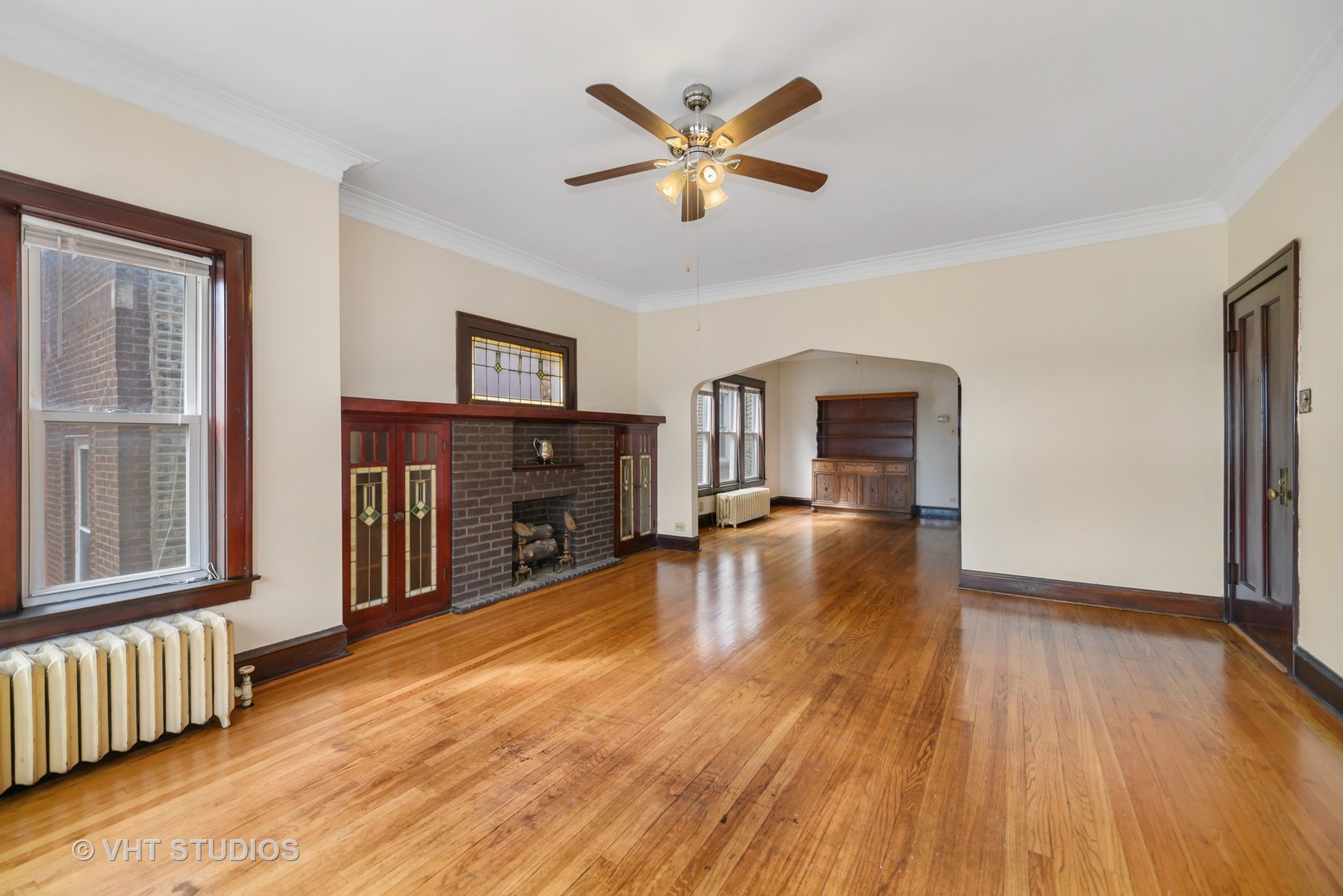 2736 North Harding Avenue, Unit 2 Chicago, IL 60647 - Photo 4 of 12 a living room with fireplace furniture and a wooden floor