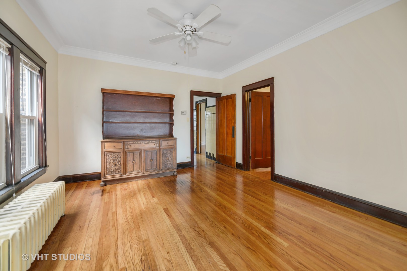2736 North Harding Avenue, Unit 2 Chicago, IL 60647 - Photo 5 of 12 a view of an empty room with a window and wooden floor