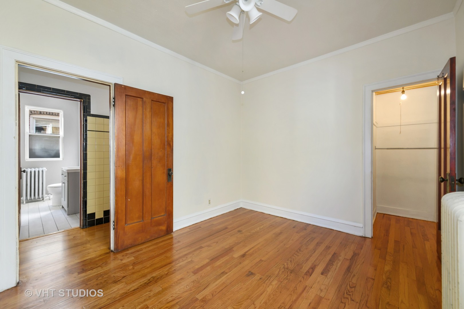 2736 North Harding Avenue, Unit 2 Chicago, IL 60647 - Photo 9 of 12 a view of empty room with wooden floor and fan