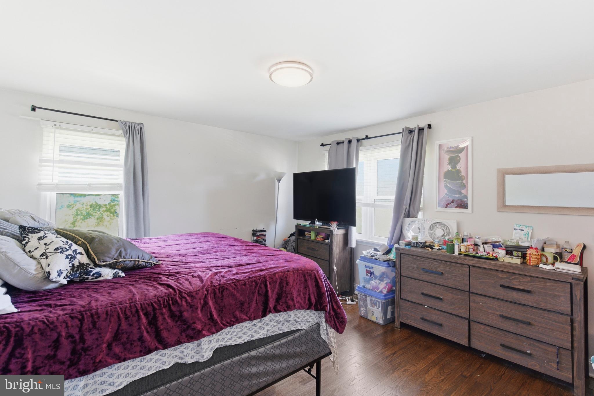 912 Shelley Road Towson, MD 21286 - Photo 15 of 27 a bedroom with a bed and a flat screen tv