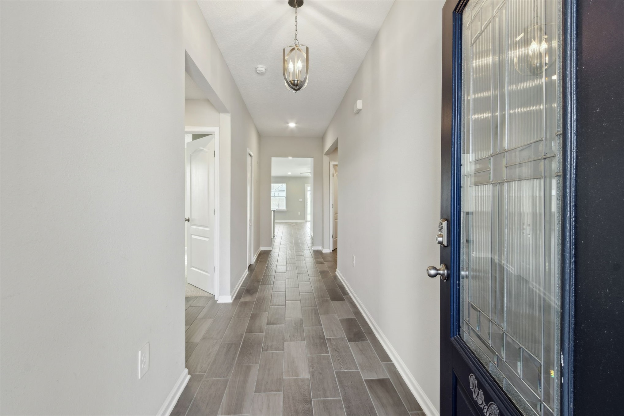 65860 Edgewater Drive Yulee, FL 32097 - Photo 15 of 39 a view of a hallway with wooden floor