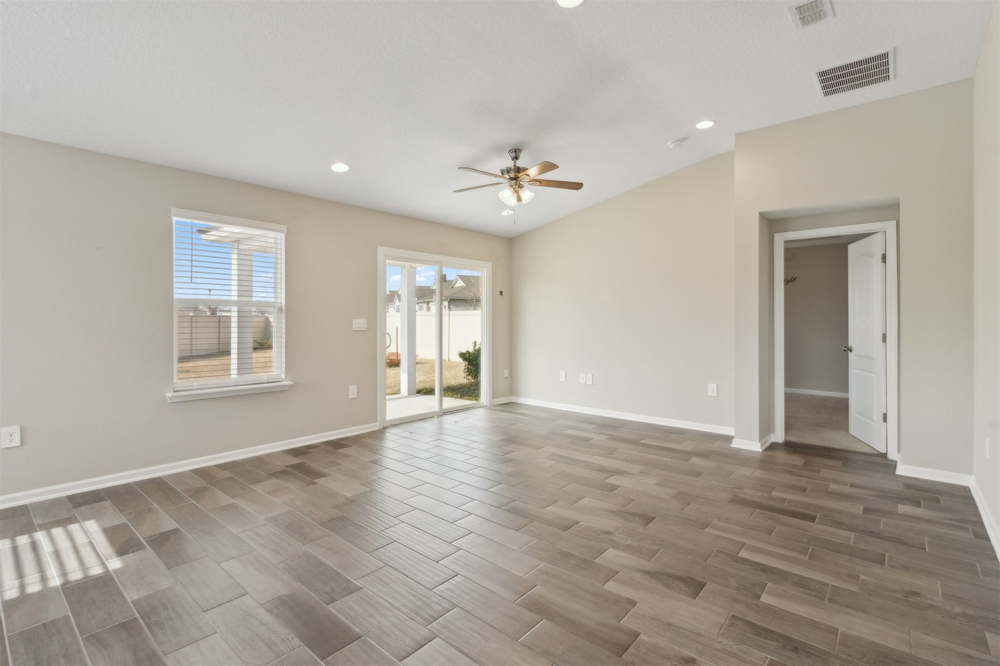 65860 Edgewater Drive Yulee, FL 32097 - Photo 16 of 39 a view of an empty room with a window