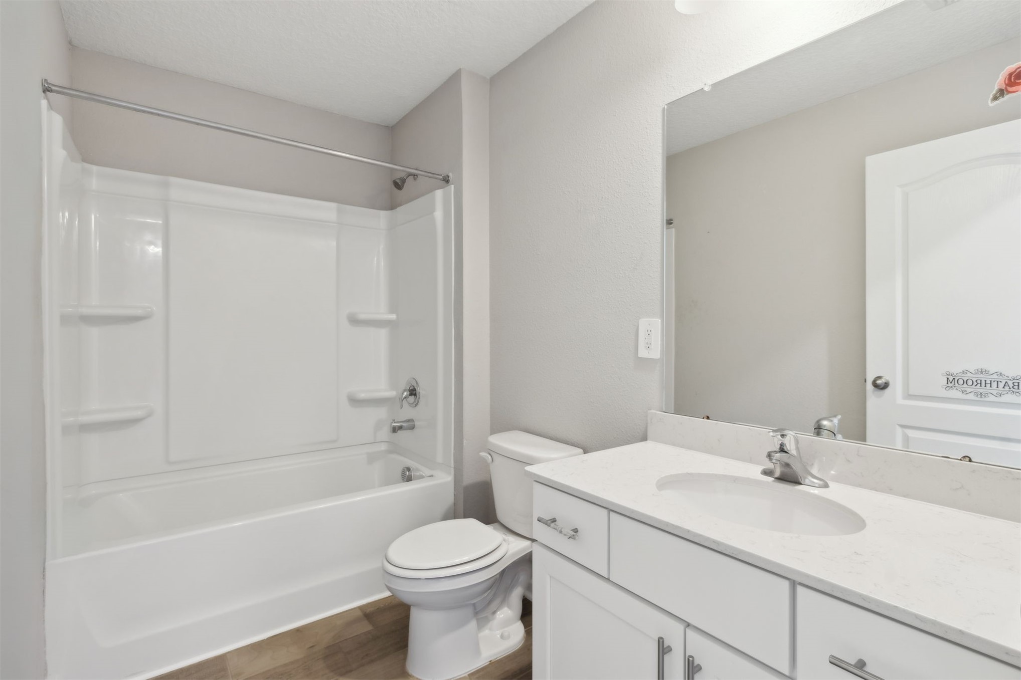 65860 Edgewater Drive Yulee, FL 32097 - Photo 21 of 39 a bathroom with a sink a toilet and a bathtub