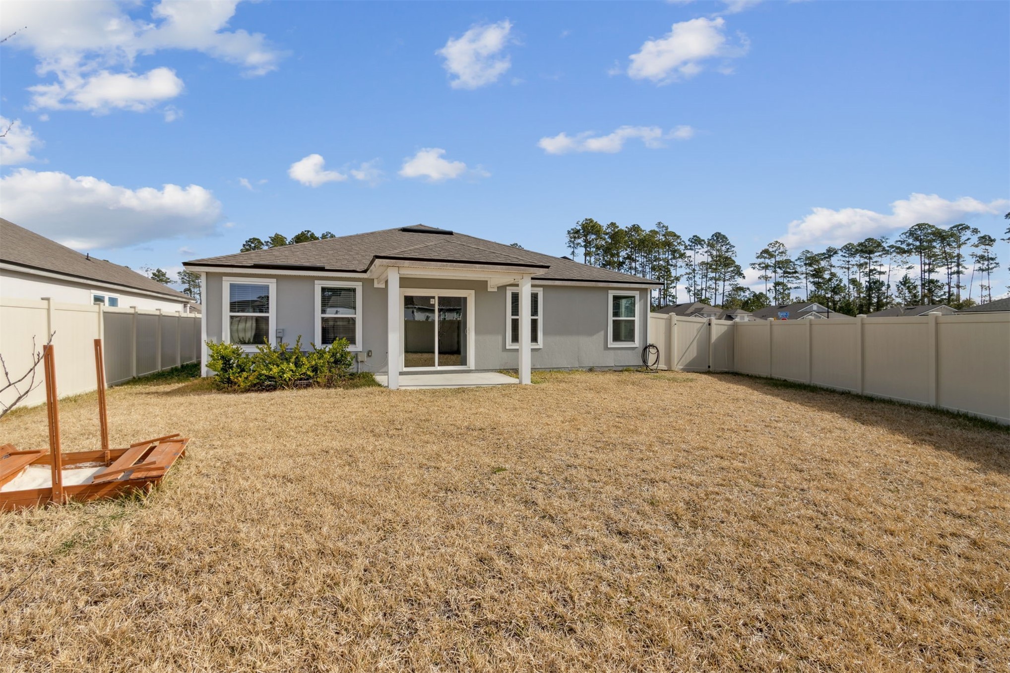 65860 Edgewater Drive Yulee, FL 32097 - Photo 28 of 39 a house view with a backyard space