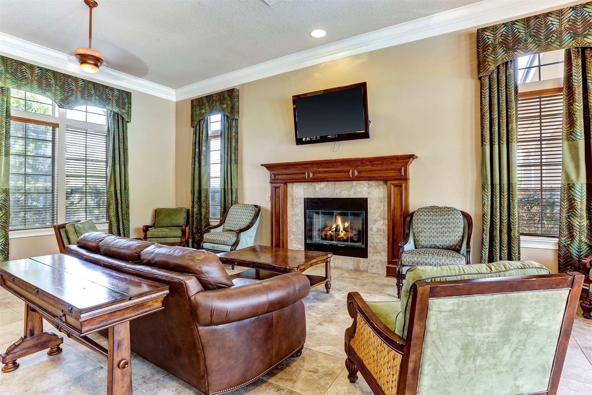 65860 Edgewater Drive Yulee, FL 32097 - Photo 32 of 39 a living room with furniture fireplace and flat screen tv