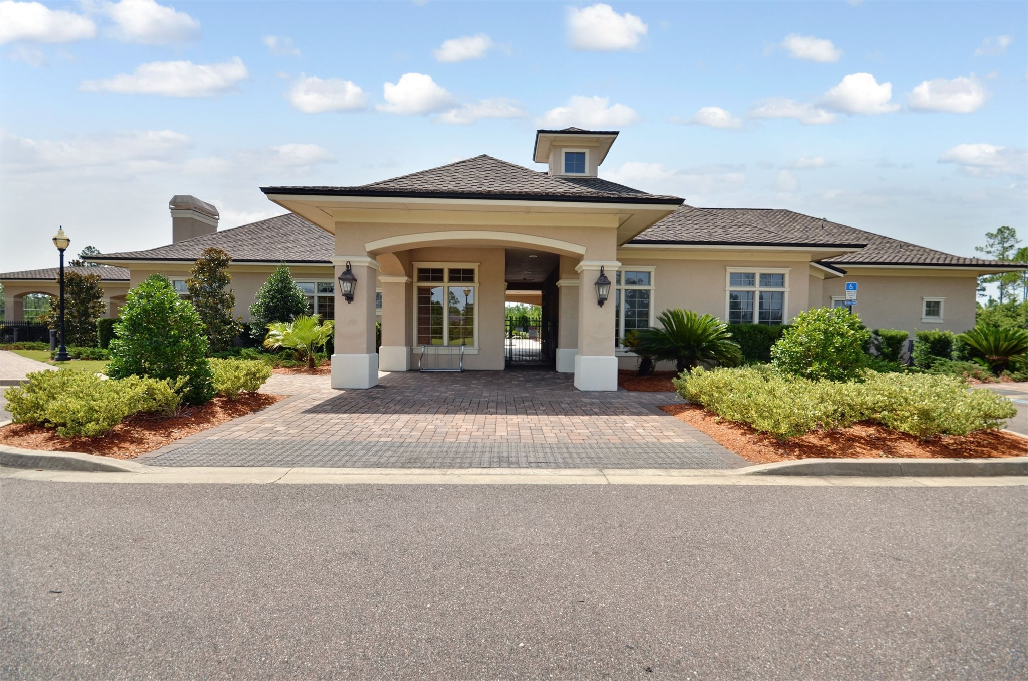 65860 Edgewater Drive Yulee, FL 32097 - Photo 33 of 39 a front view of a house with a garden