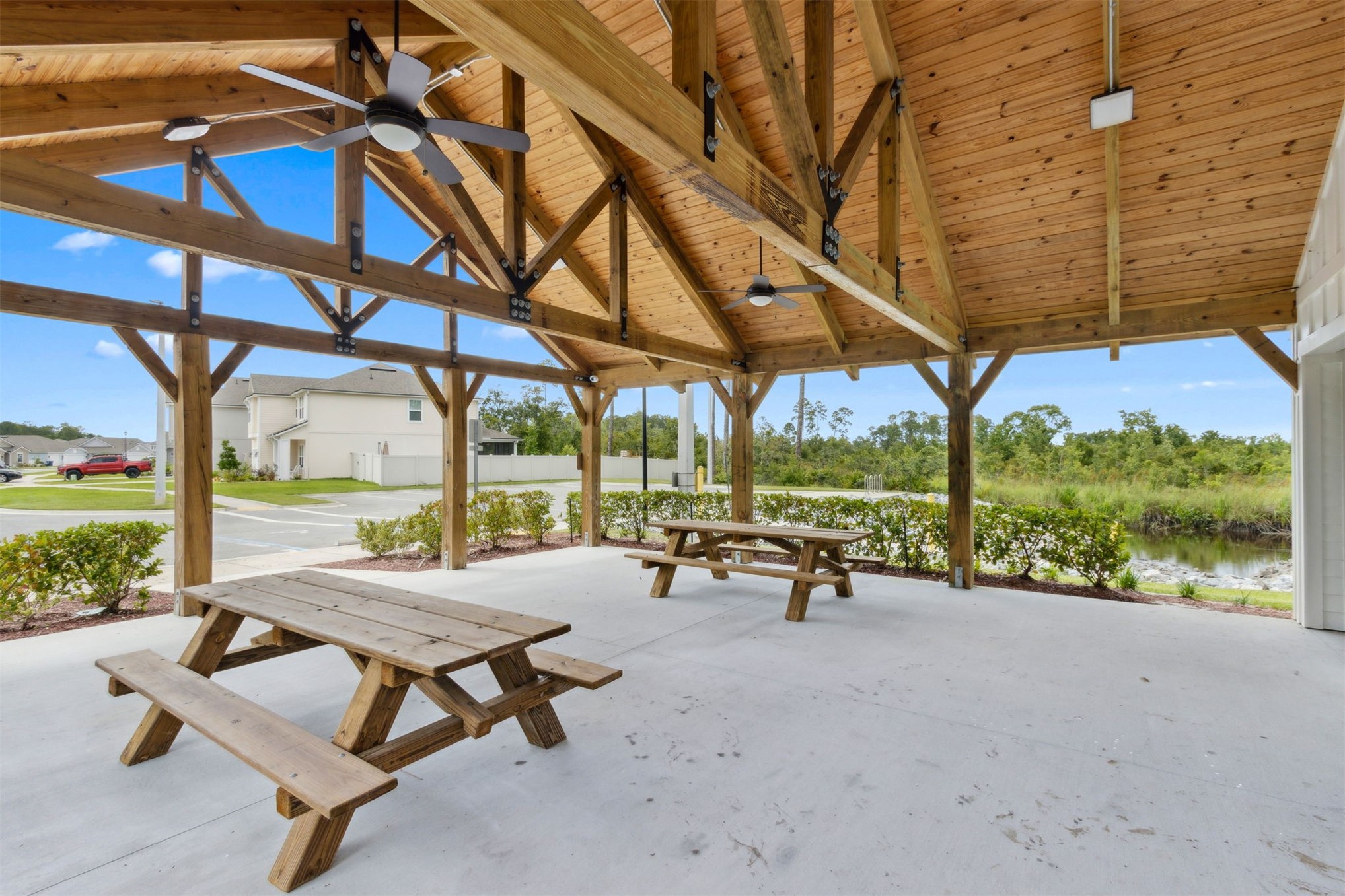 65860 Edgewater Drive Yulee, FL 32097 - Photo 36 of 39 a view of a patio with a table chairs and a backyard