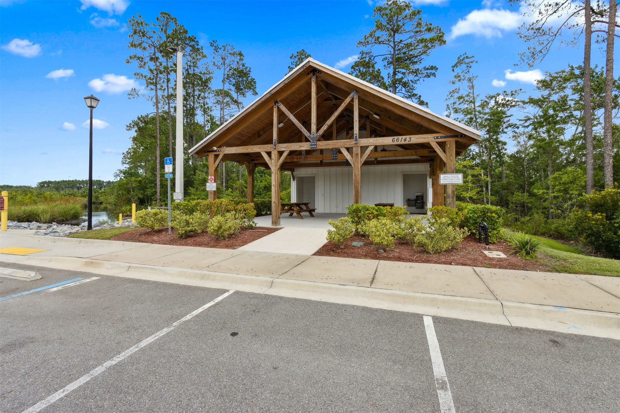 65860 Edgewater Drive Yulee, FL 32097 - Photo 37 of 39 a front view of a house with a yard