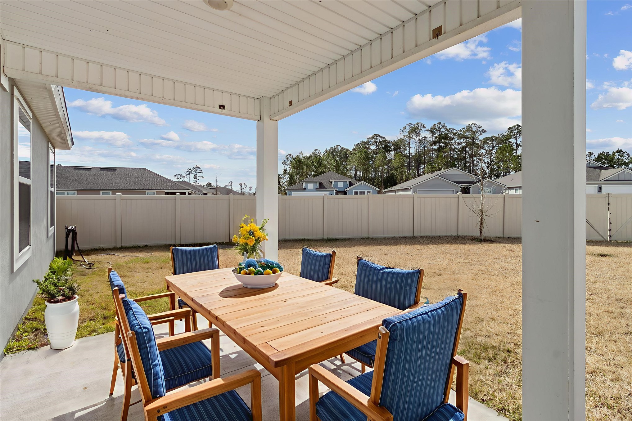 65860 Edgewater Drive Yulee, FL 32097 - Photo 5 of 39 a view of an outside dining space with furniture