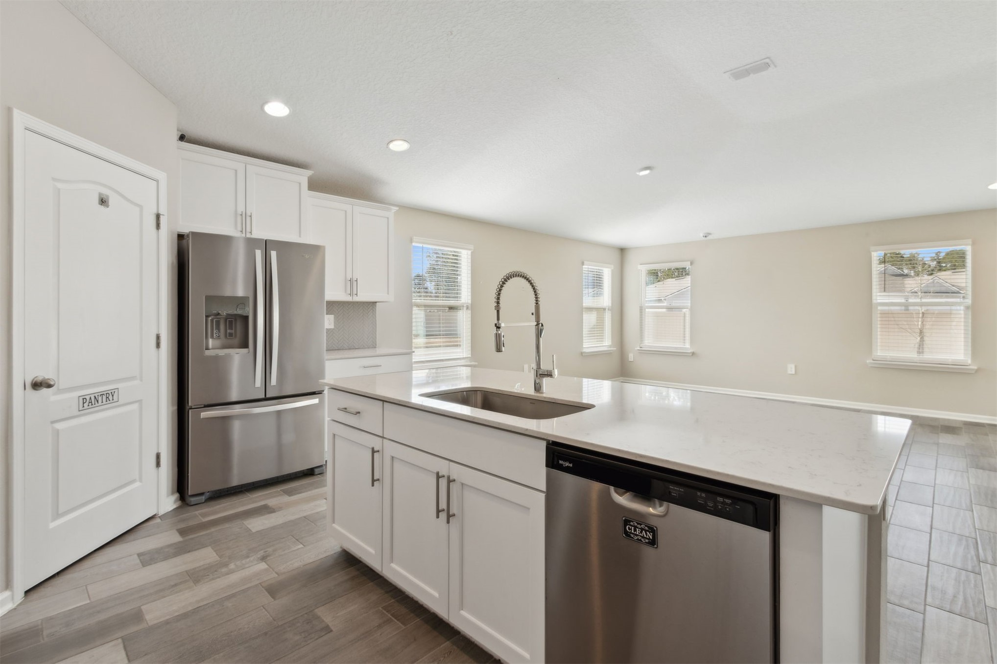 65860 Edgewater Drive Yulee, FL 32097 - Photo 6 of 39 a kitchen with a sink appliances and cabinets