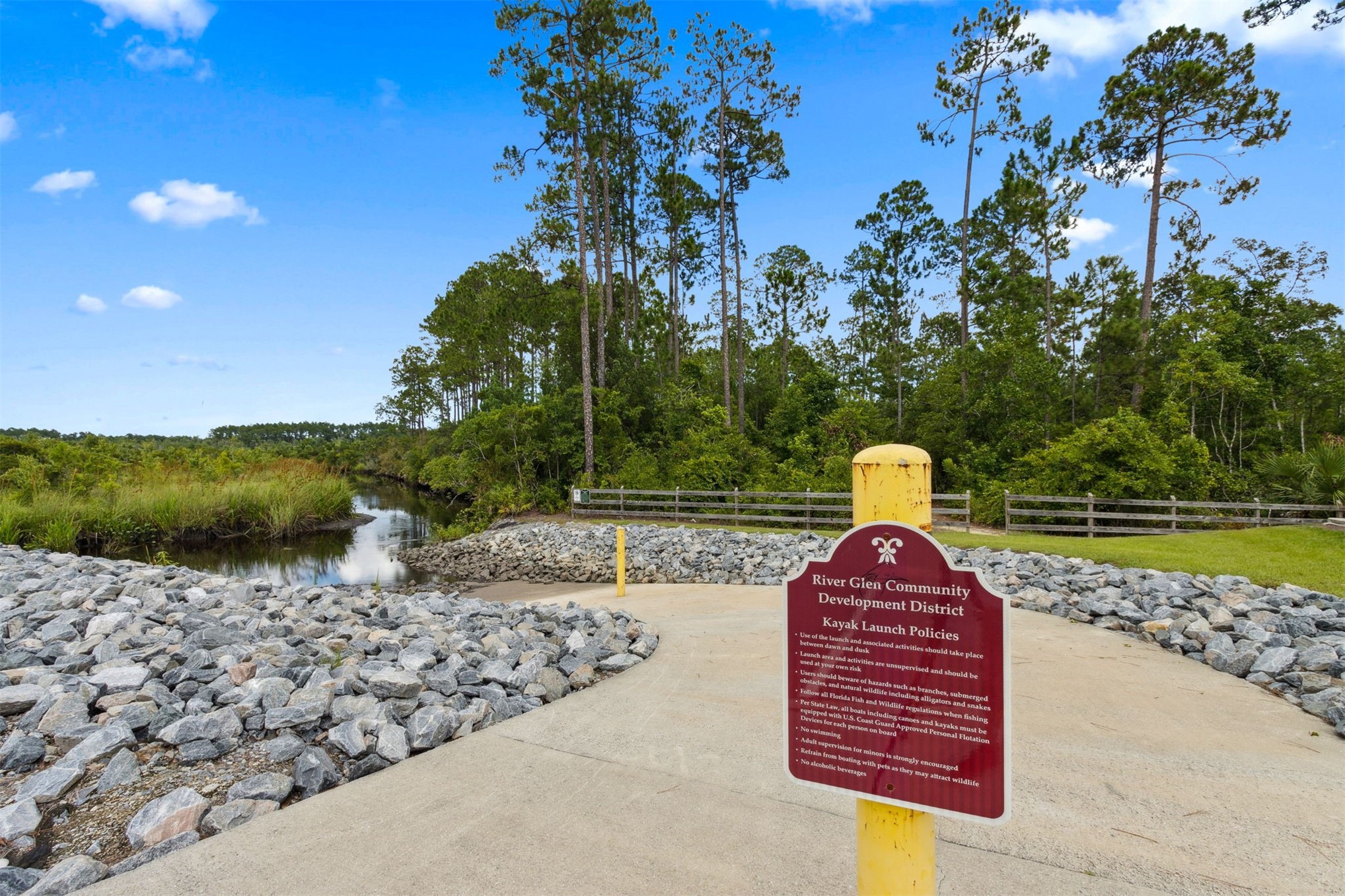 65860 Edgewater Drive Yulee, FL 32097 - Photo 10 of 39 a view of a yard along with trees