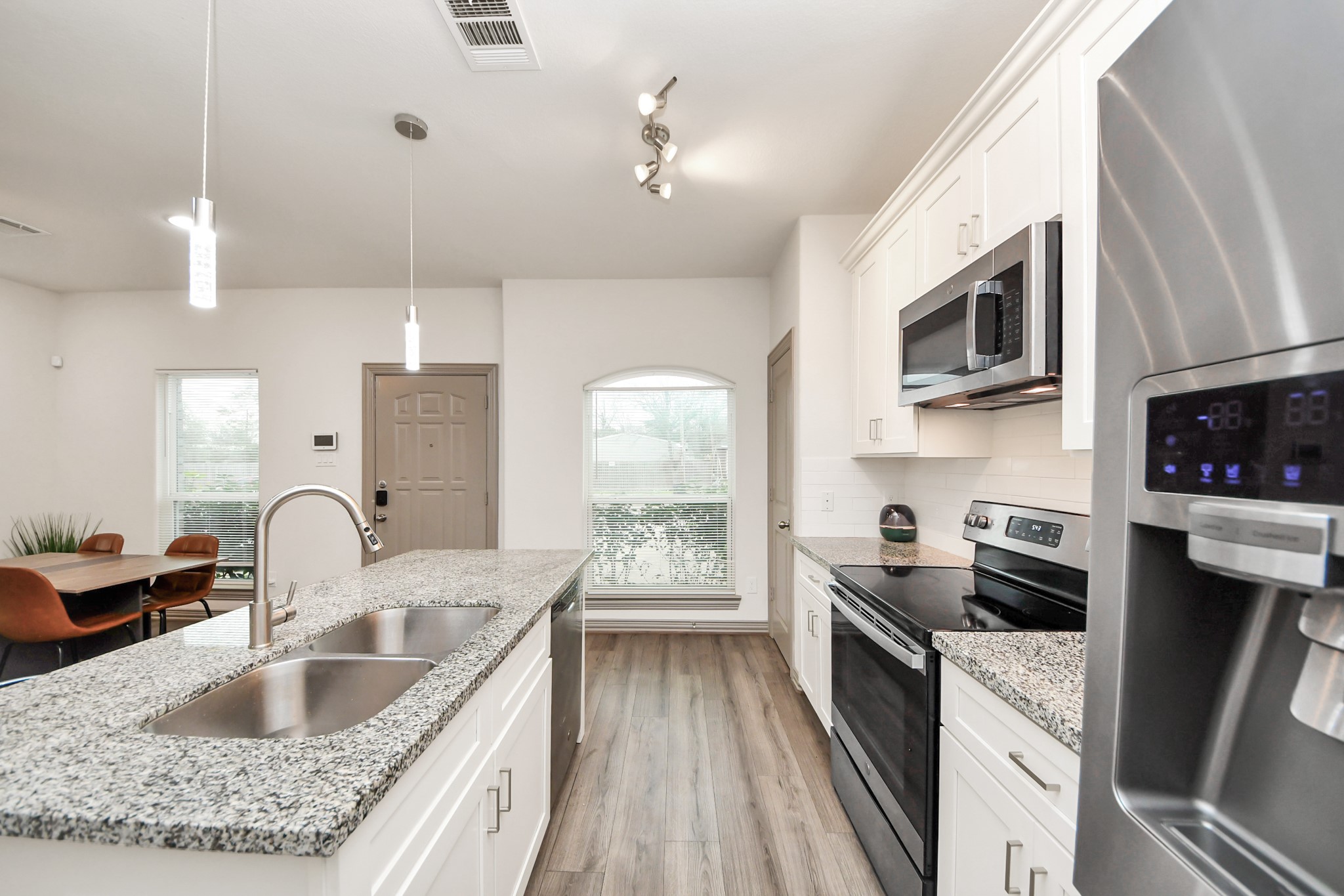 5334 Pershing Street Houston, TX 77033 - Photo 33 of 43 a kitchen with granite countertop a sink stainless steel appliances and cabinets
